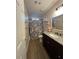 Bathroom featuring a granite vanity, a floral shower curtain, and stylish fixtures at 25 Clay Ct, Hiram, GA 30141