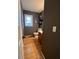 Powder room has wood-look flooring and neutral paint at 25 Clay Ct, Hiram, GA 30141