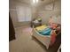 Cozy bedroom features a Disney-themed bed, an accent chair, and a serene atmosphere at 25 Clay Ct, Hiram, GA 30141