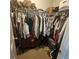 Walk-in closet with an abundance of storage space on multiple hanging rods and shelves at 25 Clay Ct, Hiram, GA 30141