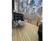 Spacious deck with outdoor seating overlooking a natural landscape and playset at 25 Clay Ct, Hiram, GA 30141