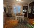 Charming dining room featuring a rustic table and chairs, window, and hardwood floors at 25 Clay Ct, Hiram, GA 30141