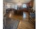 Spacious kitchen features wood cabinets, stainless appliances, island, and hardwood floors at 25 Clay Ct, Hiram, GA 30141