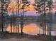 Picturesque lake view with a vibrant sunset reflected in the water at 25 Clay Ct, Hiram, GA 30141