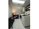 Well-equipped laundry room with modern washer and dryer, patterned floors, and convenient storage at 25 Clay Ct, Hiram, GA 30141