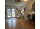 Bright living room with french doors leading to a deck and neutral colored furniture at 25 Clay Ct, Hiram, GA 30141