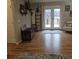 Bright living room with hardwood floors and french doors leading to a deck with water view at 25 Clay Ct, Hiram, GA 30141