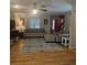 Comfortable living room featuring a brick fireplace, hardwood floors, and neutral decor at 25 Clay Ct, Hiram, GA 30141