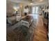 Spacious living room with hardwood floors, fireplace, and access to an outdoor deck at 25 Clay Ct, Hiram, GA 30141