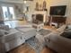 Inviting living room with hardwood floors, fireplace, and stylish neutral furniture at 25 Clay Ct, Hiram, GA 30141