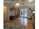 Spacious living room with hardwood floors and french doors leading to a deck with water view at 25 Clay Ct, Hiram, GA 30141