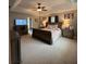 Large main bedroom features neutral carpeting, tray ceiling, and sitting area at 25 Clay Ct, Hiram, GA 30141