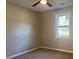 This cozy bedroom features soft carpet and a bright window, creating a relaxing atmosphere at 25 Oak Crest Ct, Covington, GA 30016