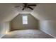 Carpeted bedroom featuring a pitched ceiling and a window at 25 Oak Crest Ct, Covington, GA 30016