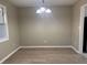 The dining room features modern flooring and a stylish light fixture, creating an inviting atmosphere at 25 Oak Crest Ct, Covington, GA 30016