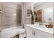 Bright bathroom with modern fixtures, featuring a bathtub and a white vanity at 81 Heritage Pointe Dr, Villa Rica, GA 30180