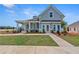 Charming two-story home with a welcoming front porch and nicely landscaped front yard at 81 Heritage Pointe Dr, Villa Rica, GA 30180