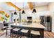 Spacious kitchen featuring stainless steel appliances, granite counters, island with seating, and open view to dining area at 81 Heritage Pointe Dr, Villa Rica, GA 30180