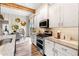 Well-equipped kitchen with granite counters, stainless appliances, island, and adjacent dining space at 81 Heritage Pointe Dr, Villa Rica, GA 30180