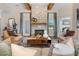 Cozy living room with stone fireplace, wood mantel, and comfortable seating at 81 Heritage Pointe Dr, Villa Rica, GA 30180