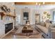 Inviting living room features a stone fireplace, wood beams, and stylish decor at 81 Heritage Pointe Dr, Villa Rica, GA 30180
