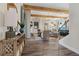 Open-concept living room with hardwood floors, wood beam ceiling and fireplace, perfect for Gathering gatherings at 81 Heritage Pointe Dr, Villa Rica, GA 30180