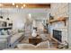 Spacious living room with stone fireplace, wood beams, and open layout at 81 Heritage Pointe Dr, Villa Rica, GA 30180