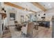 Bright living room with hardwood floors, fireplace, stylish furniture, and open concept kitchen view at 81 Heritage Pointe Dr, Villa Rica, GA 30180