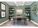 Comfortable home office featuring sophisticated decor, built-in shelving and great natural lighting at 81 Heritage Pointe Dr, Villa Rica, GA 30180