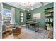 Stylish home office with natural light, custom shelving, and elegant decor for a productive workspace at 81 Heritage Pointe Dr, Villa Rica, GA 30180