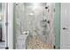 Stylish walk-in shower with a built-in bench, glass enclosure, and a wall-mounted shower head at 81 Heritage Pointe Dr, Villa Rica, GA 30180