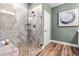 Modern glass walk-in shower featuring decorative tile and a built in bench at 81 Heritage Pointe Dr, Villa Rica, GA 30180