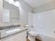 Clean bathroom featuring a vanity with mirror, toilet, and a shower-tub combination at 4239 Newcomb Rd, Decatur, GA 30034