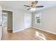 Bright bedroom featuring a ceiling fan, closet and a window that allows for natural light at 4239 Newcomb Rd, Decatur, GA 30034