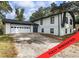 Renovated two-story home featuring an attached garage and clean, modern design at 4239 Newcomb Rd, Decatur, GA 30034