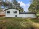 View of home showing the siding, and attached garage at 4239 Newcomb Rd, Decatur, GA 30034