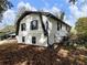Two-story home featuring white siding, black trim, and a well-maintained landscape at 4239 Newcomb Rd, Decatur, GA 30034