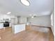 Open-concept kitchen and living area featuring an island, stainless steel appliances, and modern fixtures at 4239 Newcomb Rd, Decatur, GA 30034