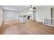 Open-concept living room and kitchen with hardwood floors and modern finishes create a bright and inviting space at 4239 Newcomb Rd, Decatur, GA 30034
