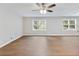 Spacious living room with new hardwood floors, neutral paint, and abundant natural light from large windows at 4239 Newcomb Rd, Decatur, GA 30034