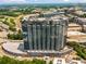 Elevated view of luxurious high-rise with large windows, balconies, and easy access to railway and neighborhood at 788 W Marietta Nw St # 913, Atlanta, GA 30318