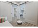 Bedroom featuring barn doors leading into hallway and bathroom at 788 W Marietta Nw St # 913, Atlanta, GA 30318