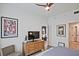Well-appointed bedroom featuring a dresser with TV, neutral tones, and ample natural light at 788 W Marietta Nw St # 913, Atlanta, GA 30318