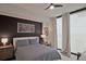 Cozy bedroom featuring soft lighting, neutral tones, and a large window with scenic views at 788 W Marietta Nw St # 913, Atlanta, GA 30318