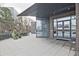 Building entrance featuring modern architecture, planters, a gated courtyard, and double glass doors at 788 W Marietta Nw St # 913, Atlanta, GA 30318