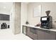 Amenity coffee bar area featuring modern appliances, stylish decor, cabinetry, and a mini refrigerator at 788 W Marietta Nw St # 913, Atlanta, GA 30318