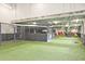 Indoor dog park with artificial turf, gated play areas, and colorful accents for a fun and safe pet experience at 788 W Marietta Nw St # 913, Atlanta, GA 30318