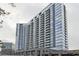 Contemporary condo building features a glass facade, parking garage, and condo leasing information at 788 W Marietta Nw St # 913, Atlanta, GA 30318