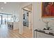 Hallway with modern finishes leads to the kitchen at 788 W Marietta Nw St # 913, Atlanta, GA 30318