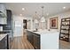Well-lit kitchen with a large island, stainless steel appliances, and stylish white countertops at 788 W Marietta Nw St # 913, Atlanta, GA 30318